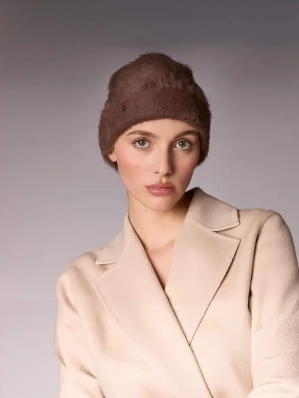 Woman wearing the winter bonnet Jane B in suede