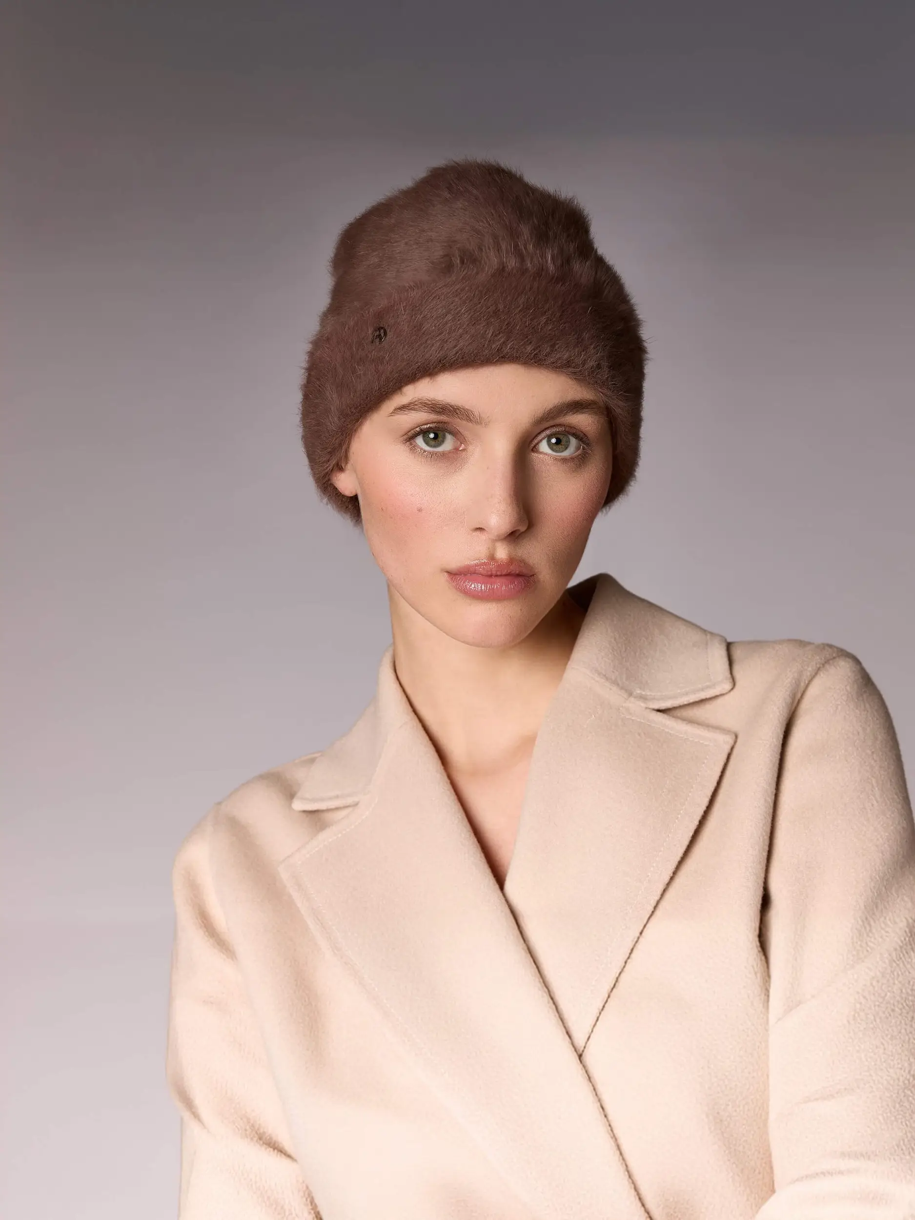 Woman wearing the winter bonnet Jane B in suede