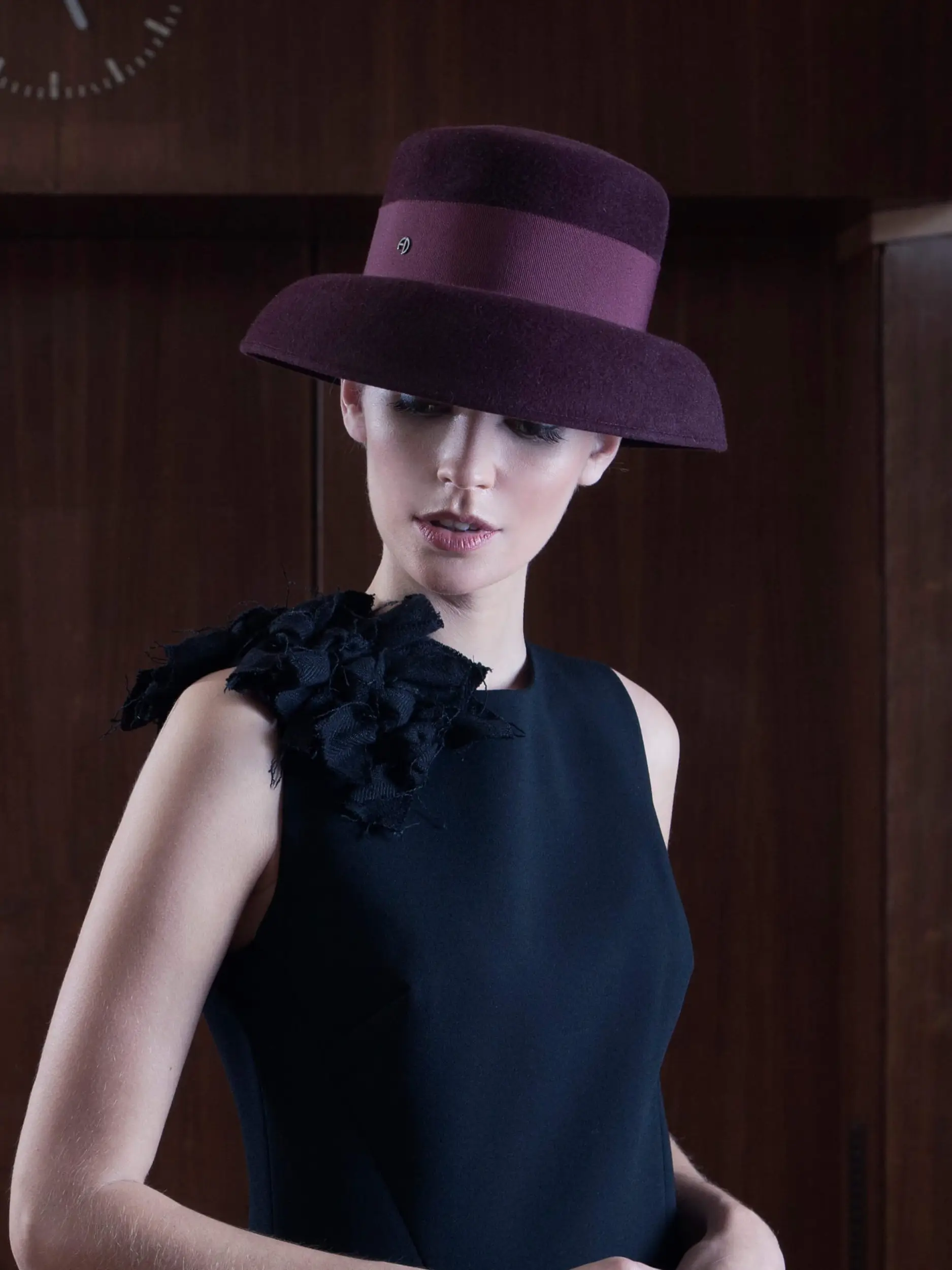 Model wearing the Little Hepburn Bordeaux felt hat in velvet