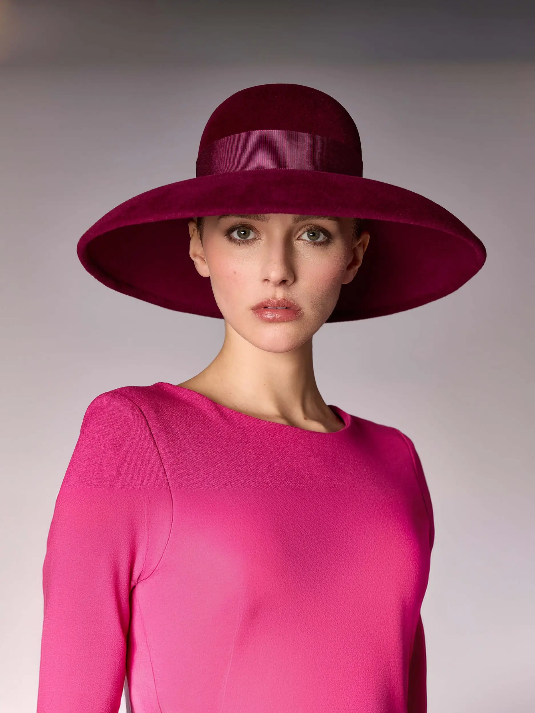 woman wearing a plum felt wedding hat - Tiffany