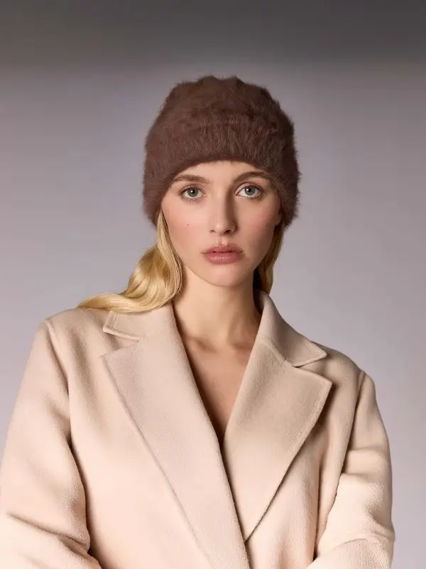 Woman wearing the winter bonnet Jane B in suede