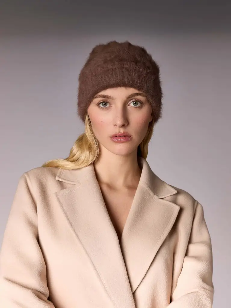 Woman wearing the winter bonnet Jane B in suede