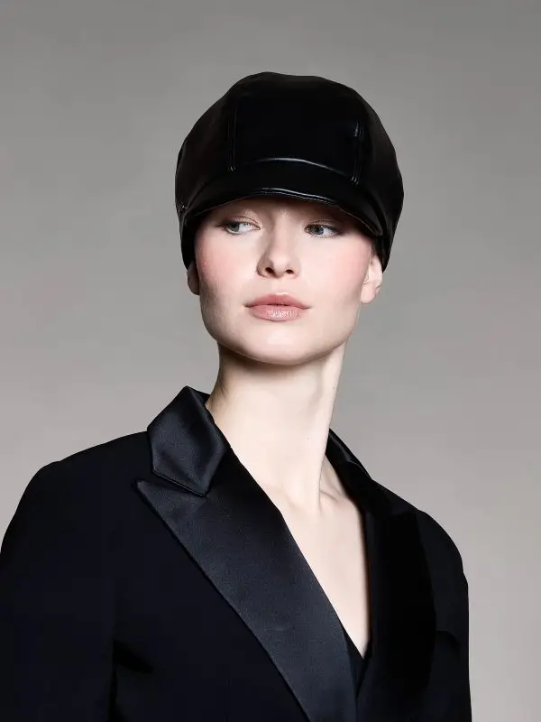 Woman wearing a black leather cap