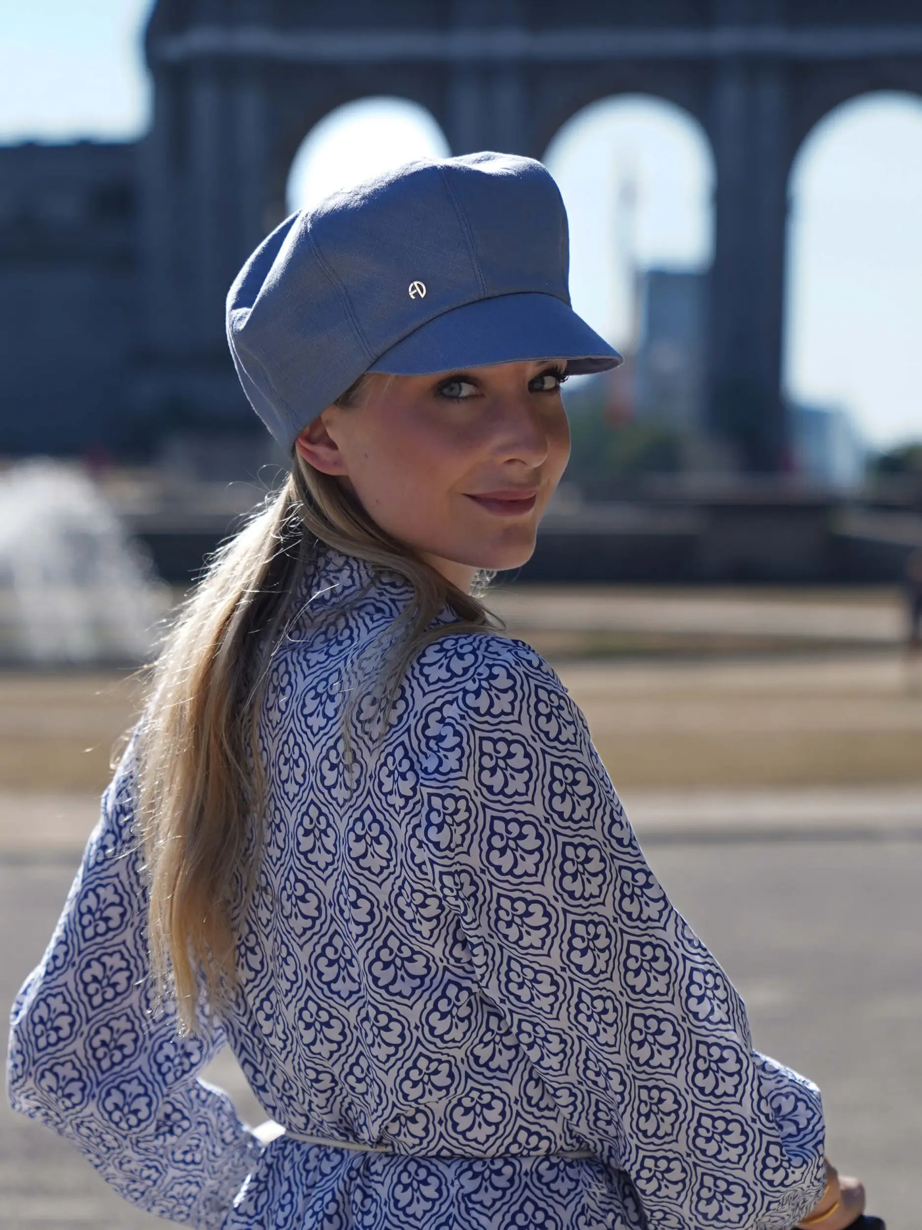 woman wearing a sky blue linen cap
