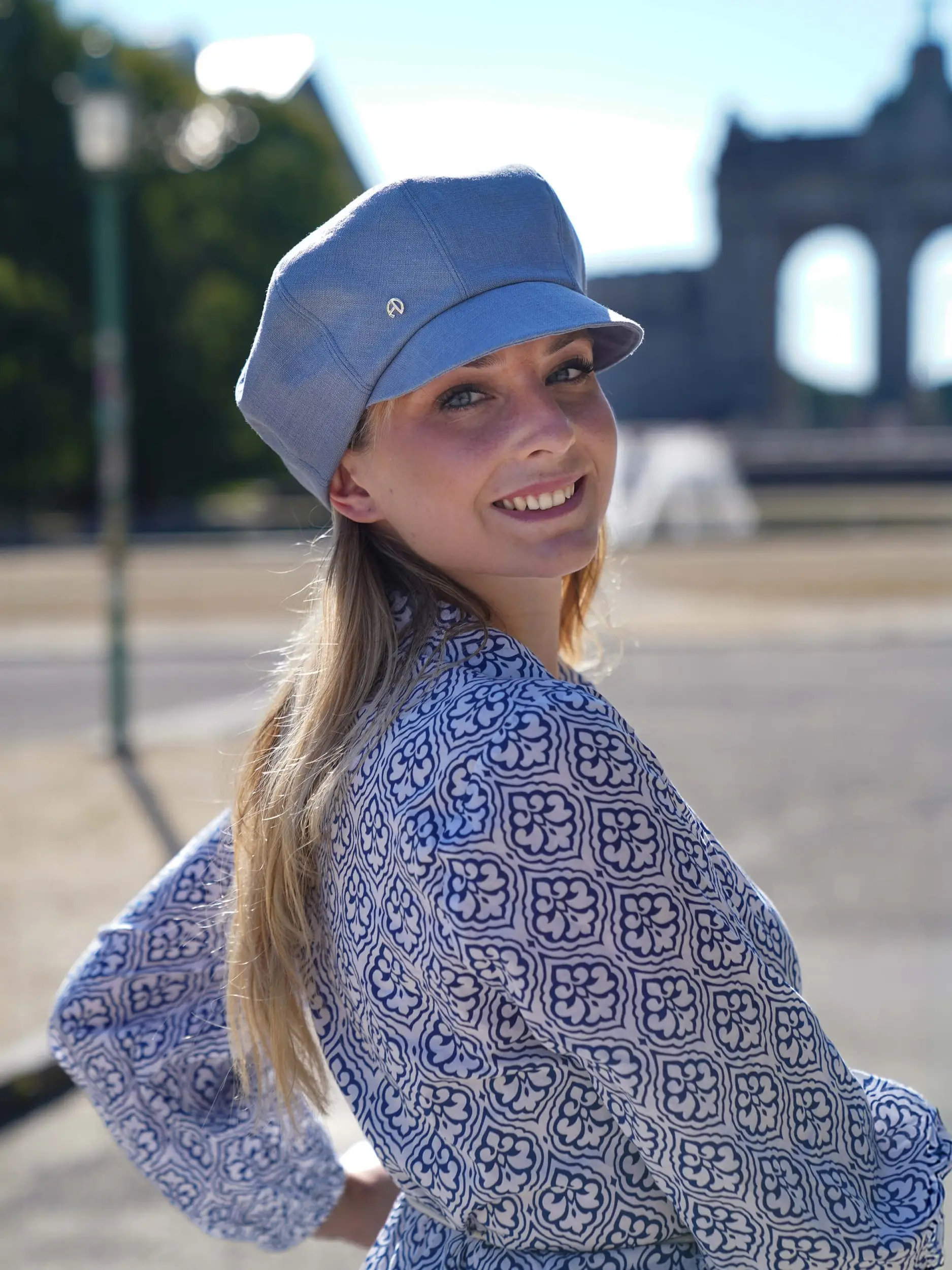 woman wearing a sky blue linen cap