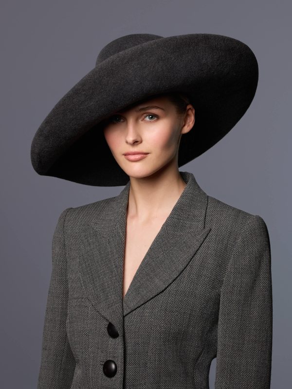 Mannequin wearing a dark grey velour felt floppy hat with a turned-up brim