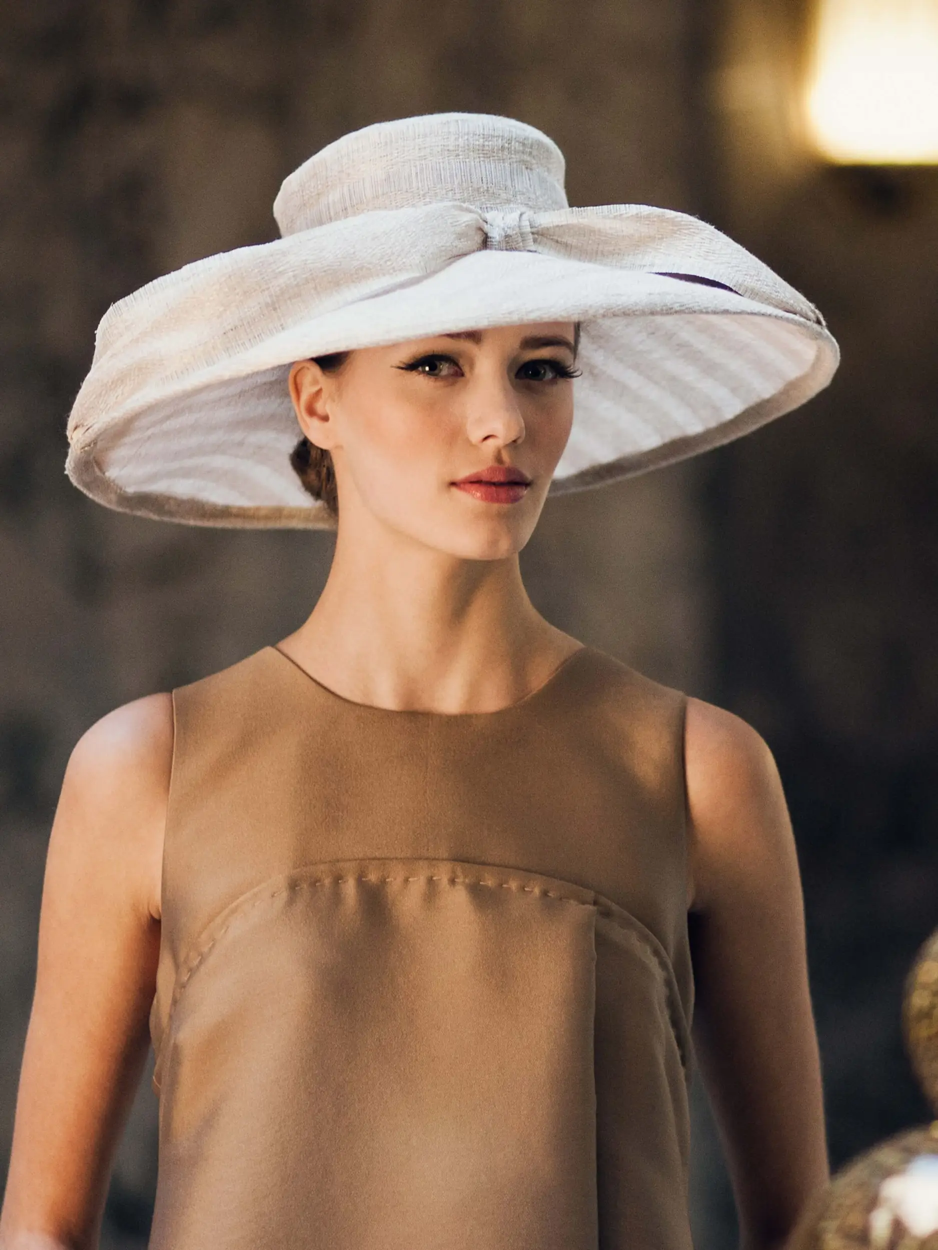 Woman wearing the Hepburn banana fiber wedding hat