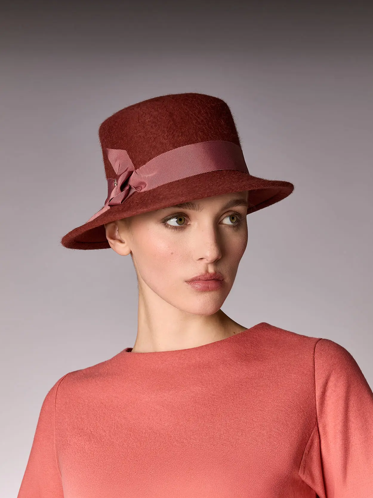 Mannequin wearing an asymmetrical velvet felt boater hat in rock ptarmigan colour
