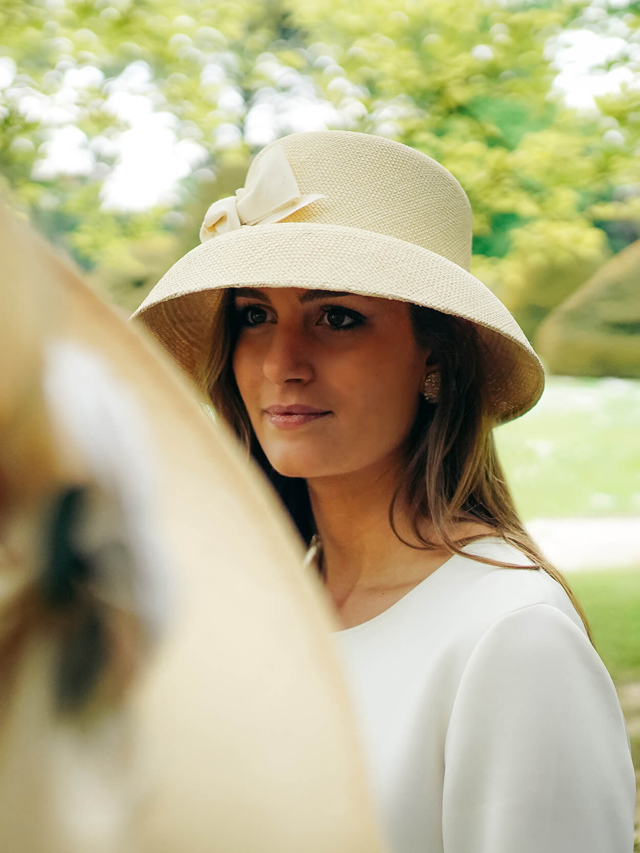 Mannequin wearing the natural straw Audrey cloche hat