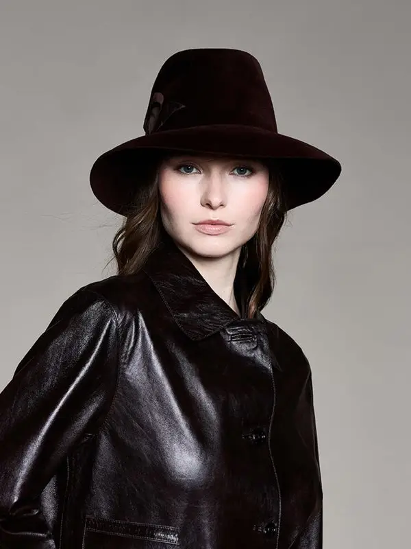 Woman wearing a brown felt fedora hat