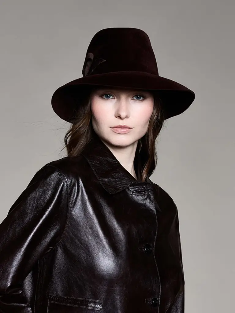 Woman wearing a brown felt fedora hat