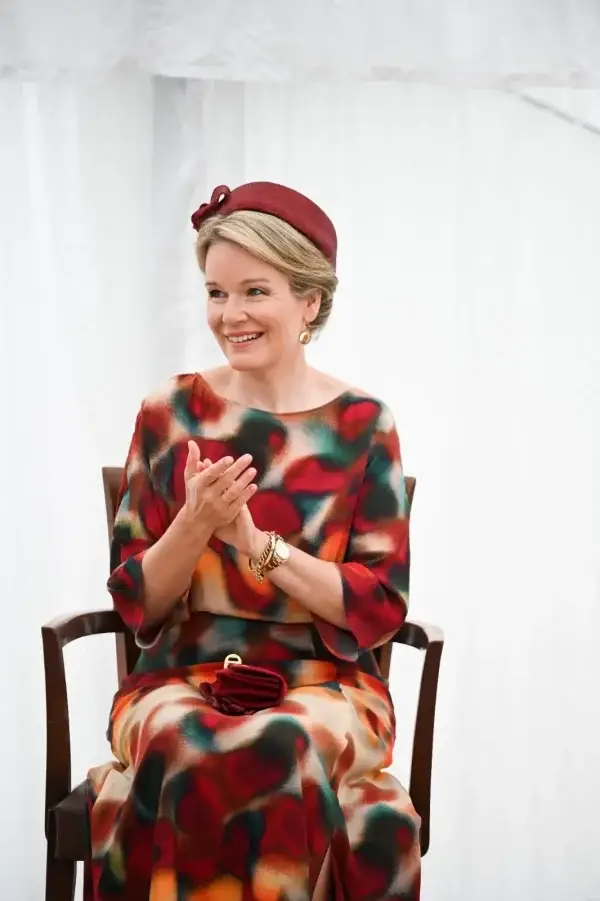 Queen Mathilde of Belgium wearing a burgundy "Elsa" Kennedy pillbox hat, Maison, by Fabienne Delvigne