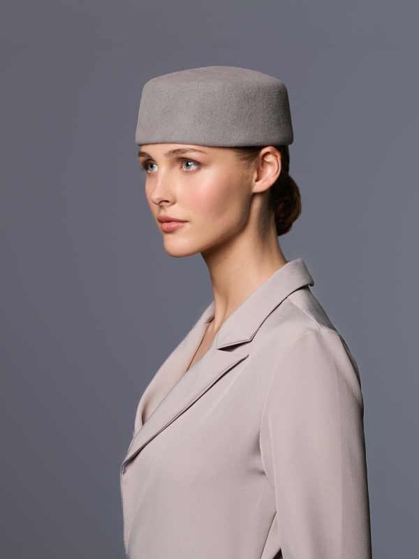 Woman wearing the grey Kathy toque