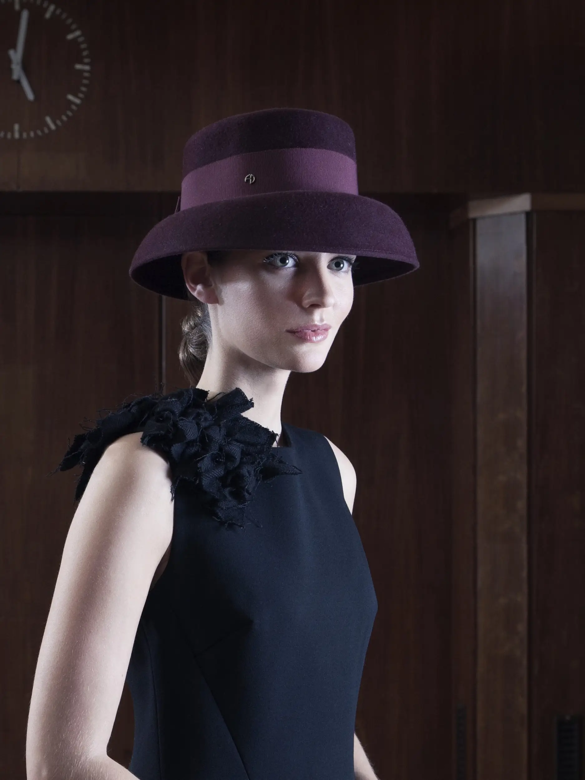 Model wearing the Little Hepburn Bordeaux felt hat in velvet