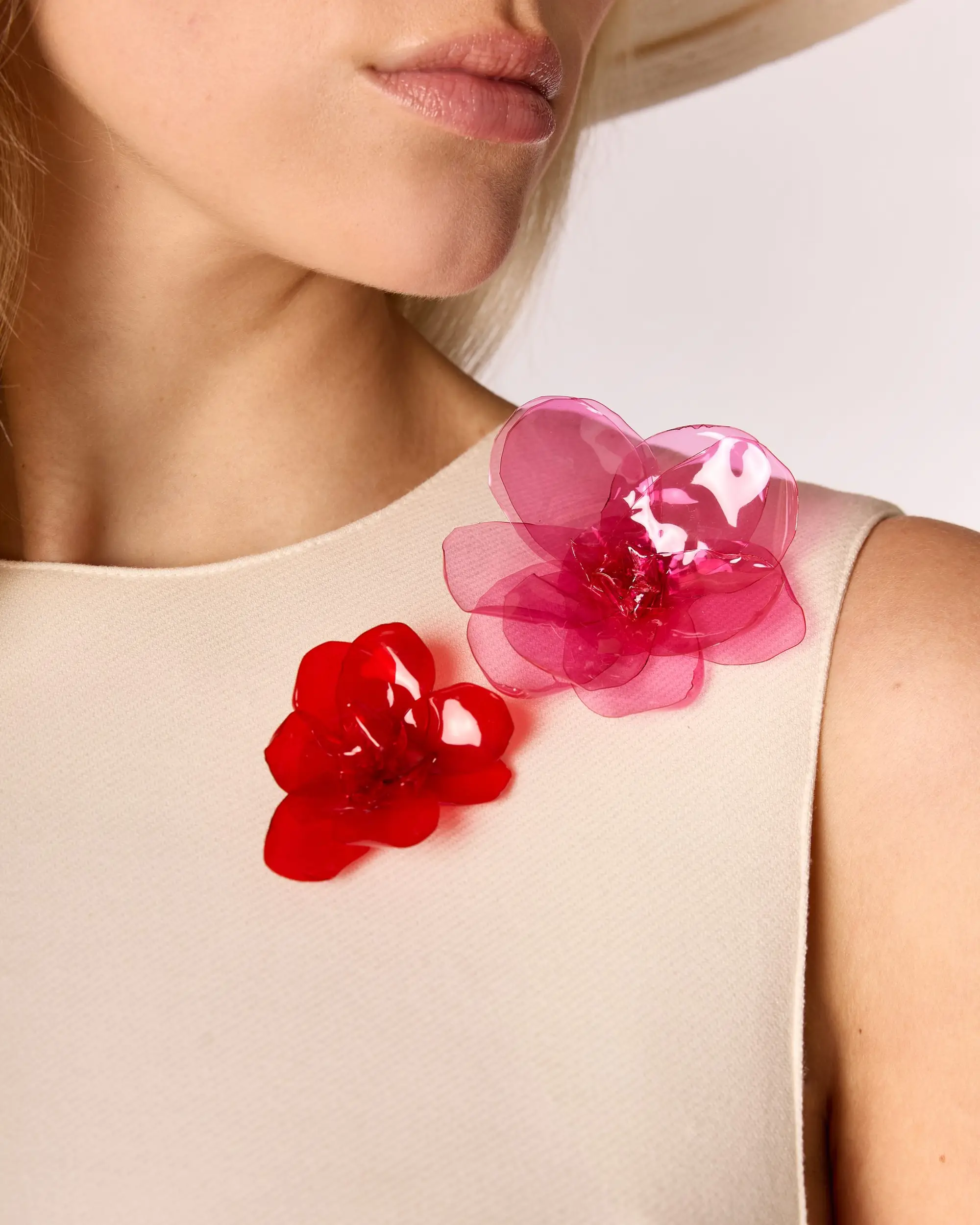 Mannequin wearing Bloomies pink and red flower brooches